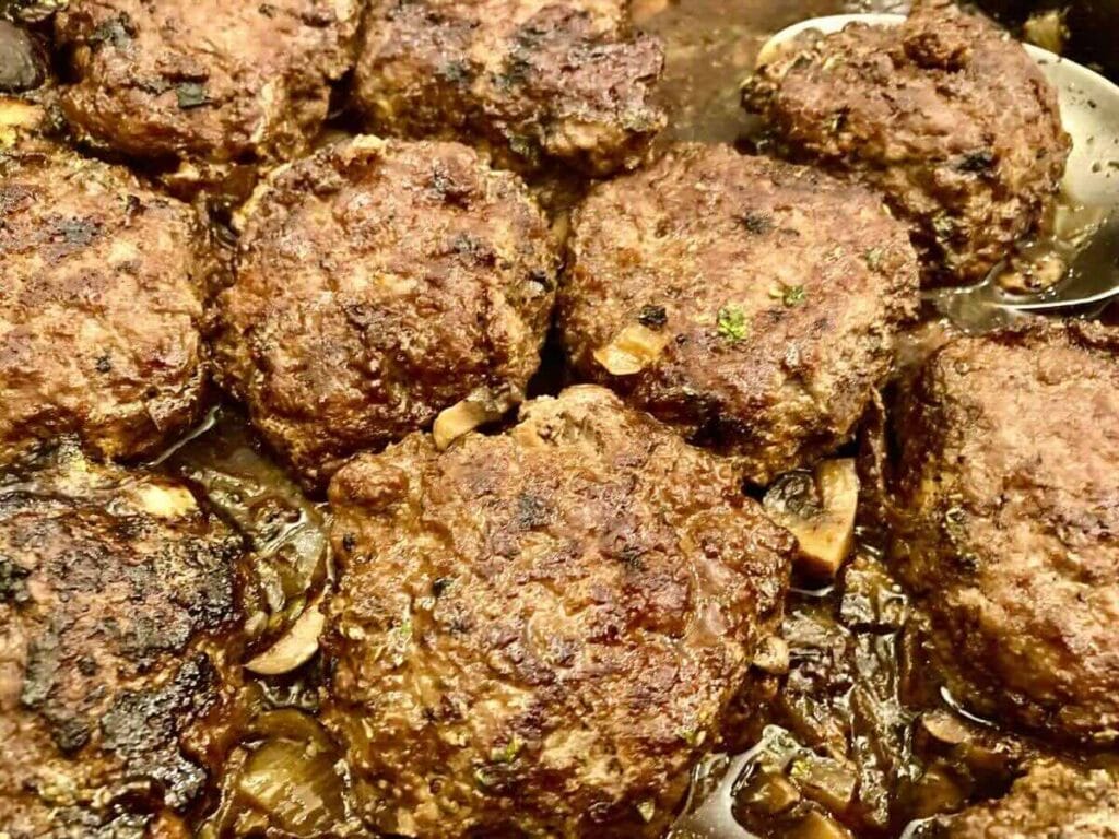 close up of gluten-free Salisbury Steak with spoon