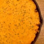Half a skillet with sweet potato cottage pie
