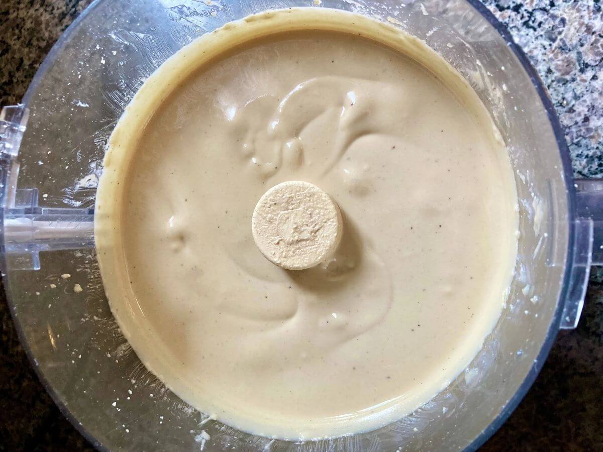 Finished cashew butter in a food processor.