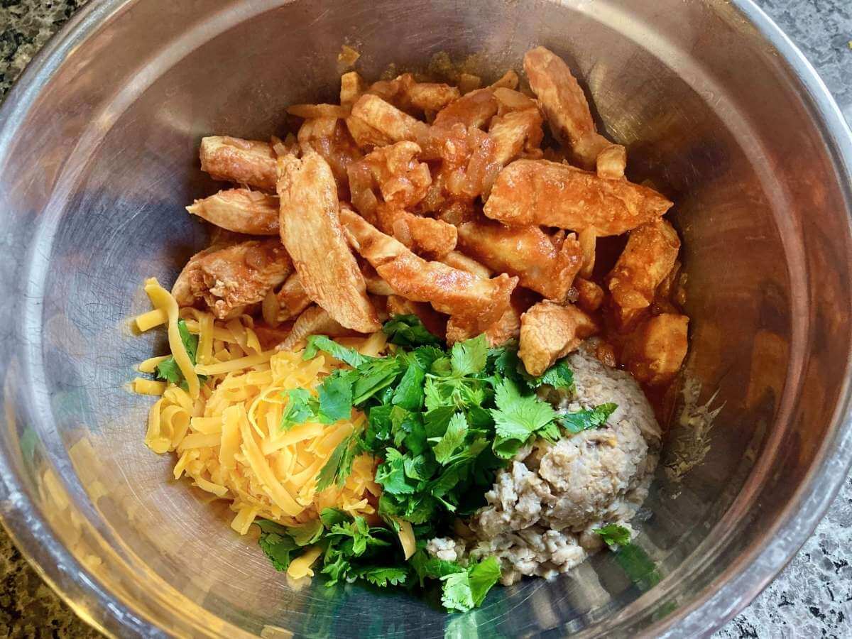 Enchilada filling ingredients in a bowl.