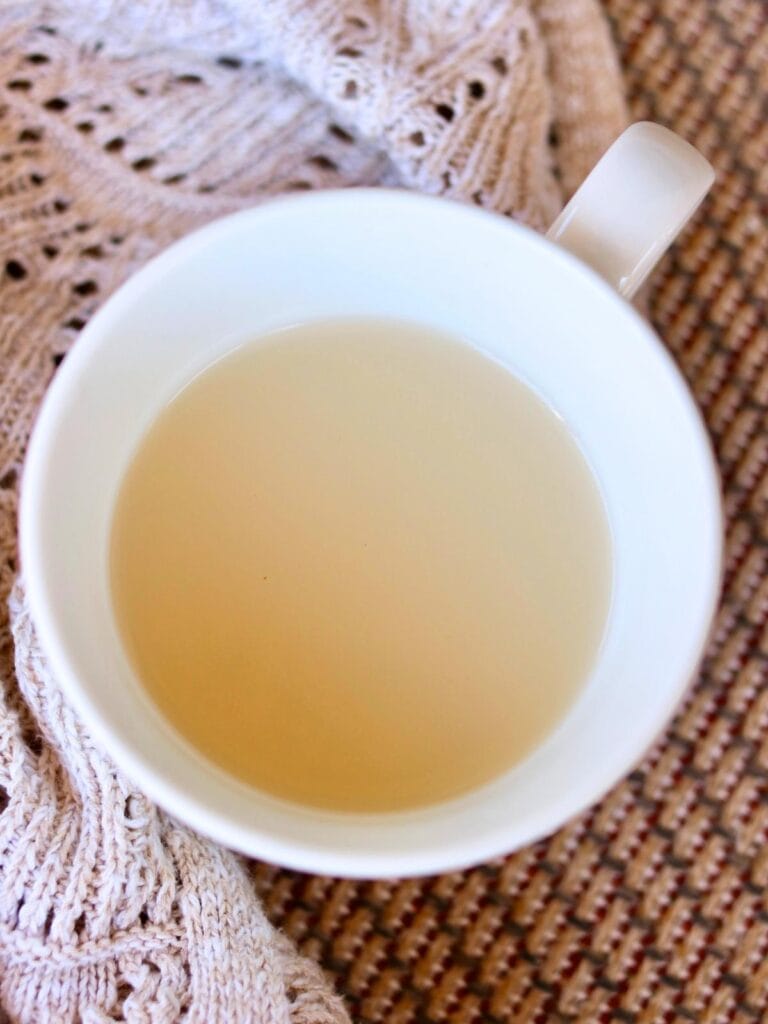 White mug with bone broth.