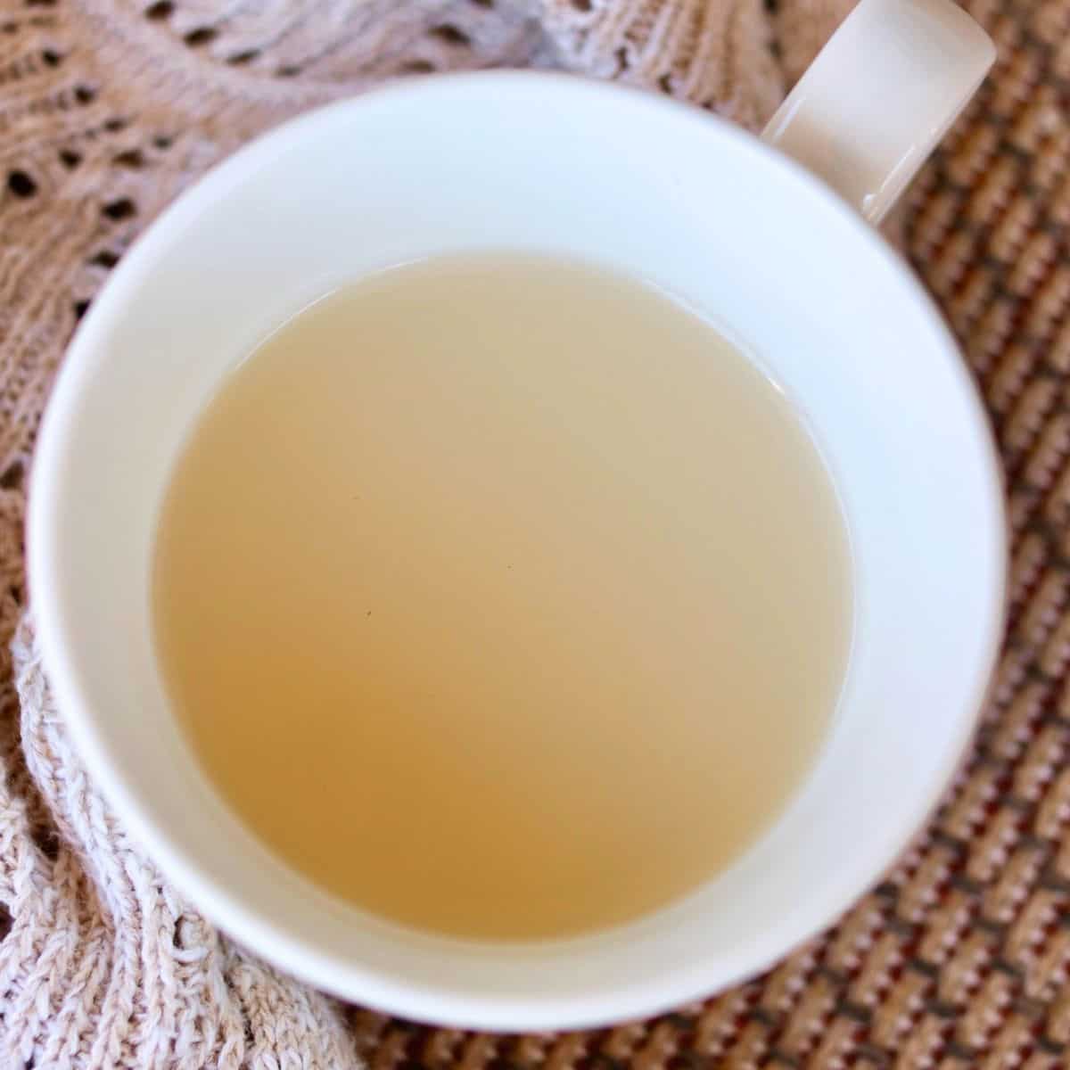 Close up of bone broth in a mug.