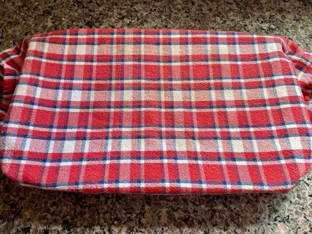 Baking dish covered with a towel.