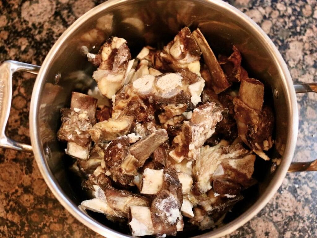 Roasted bones in a stockpot.