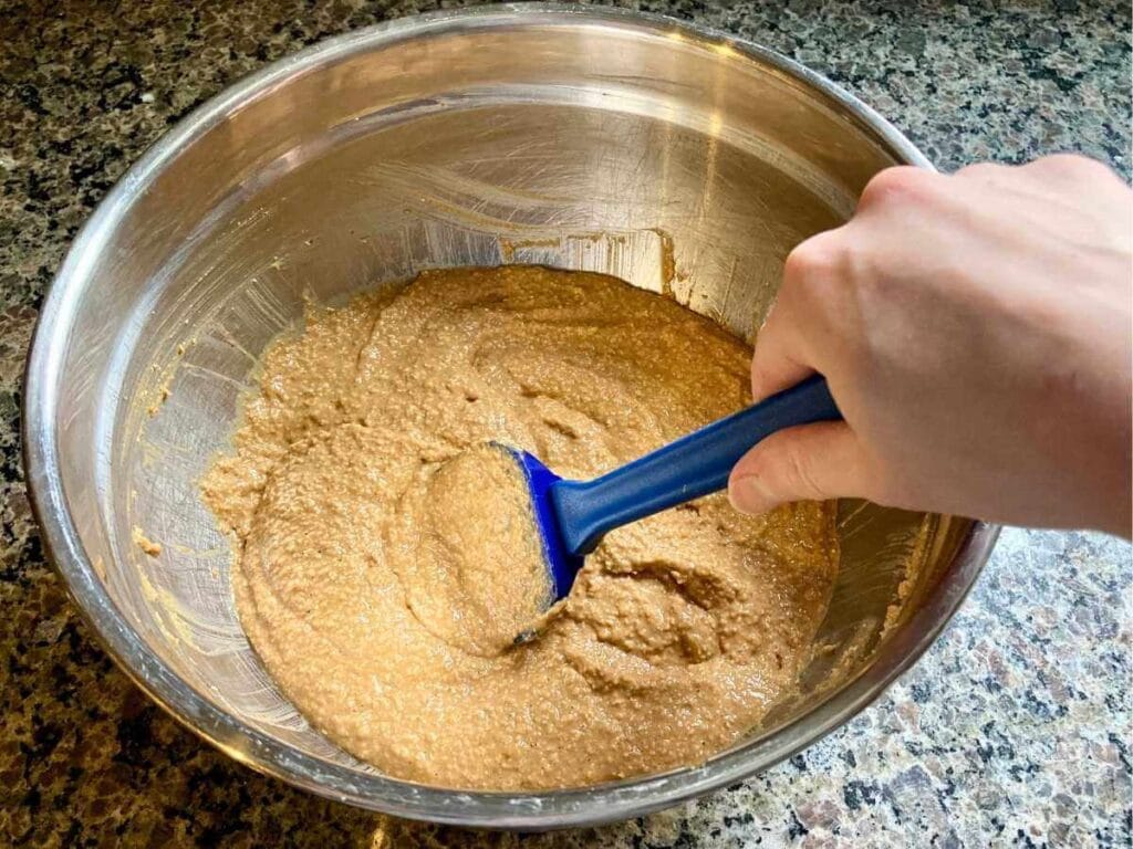 Stirring pumpkin batter.