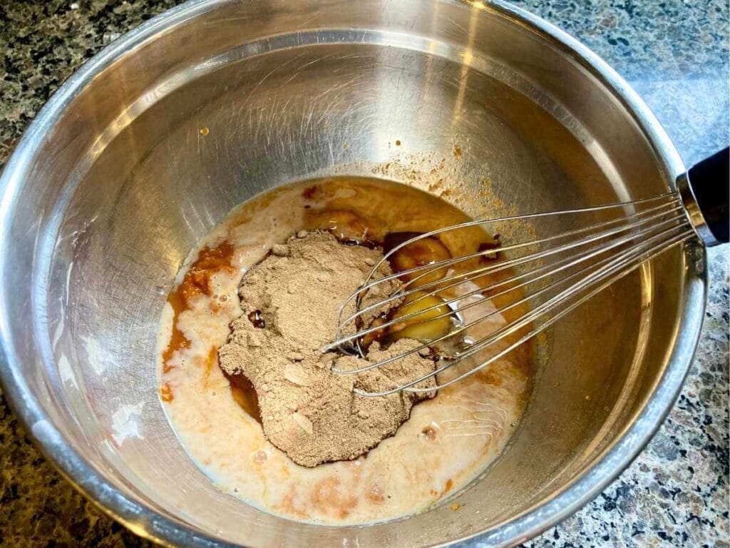 Whisking batter in a bowl.