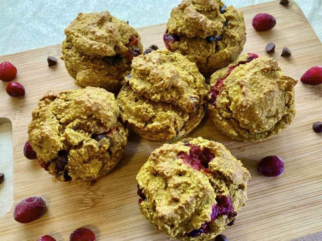 Top view of 6 pumpkin cranberry muffins.