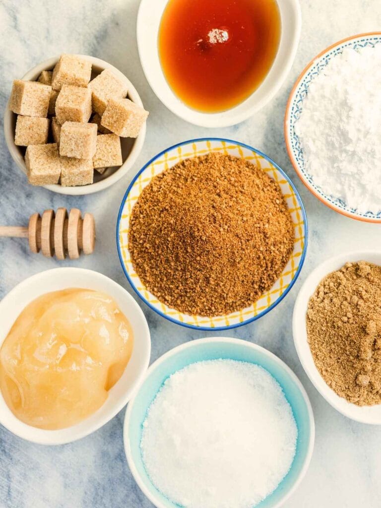 Various types of sugar on a counter.