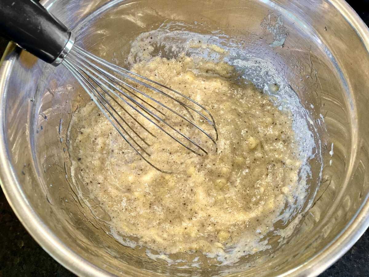Whisking batter in a bowl.