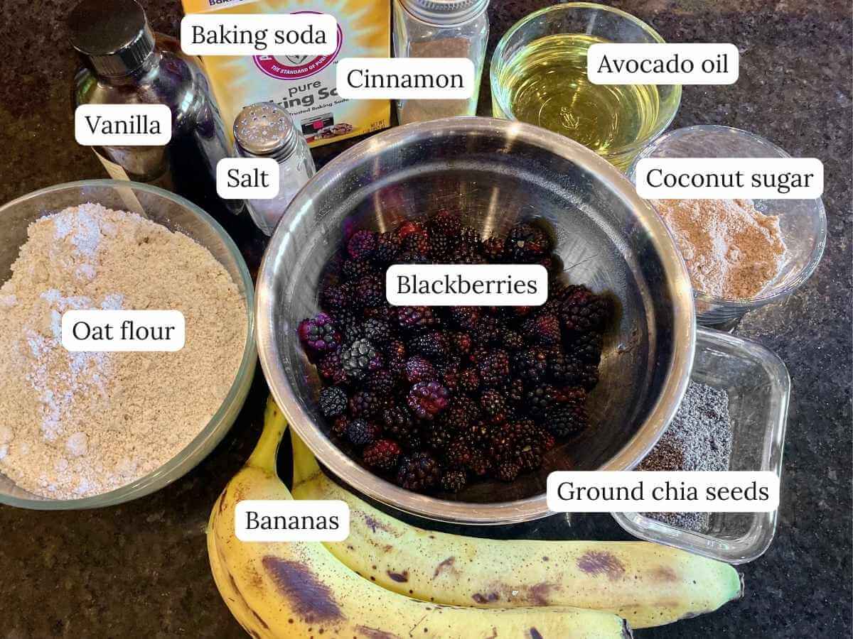 Ingredients for blackberry banana breakfast muffins on a counter.
