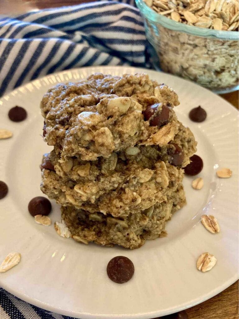 Stack of three gluten-free chocolate oatmeal cookies on a plate.