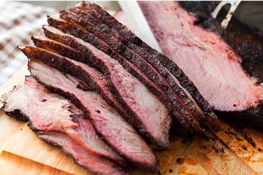 Sliced steak on cutting board