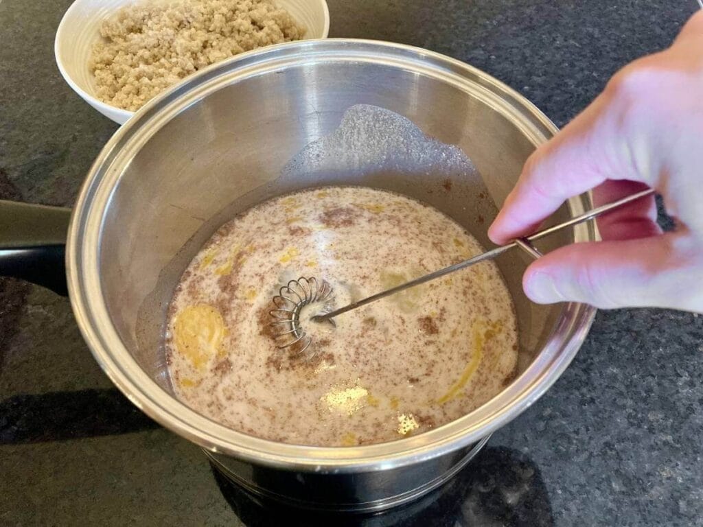 Whisking quinoa pudding liquid ingredients together.