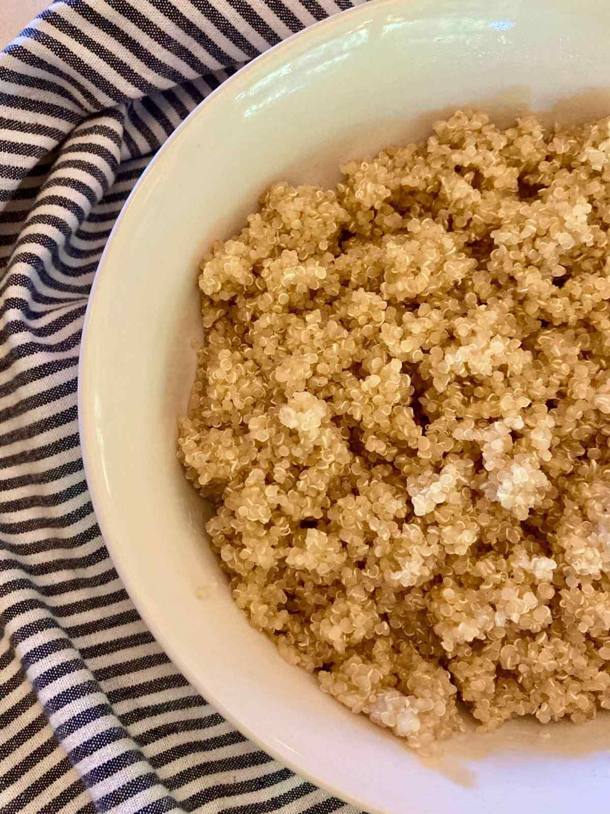 Bowl of cooked soaked quinoa.