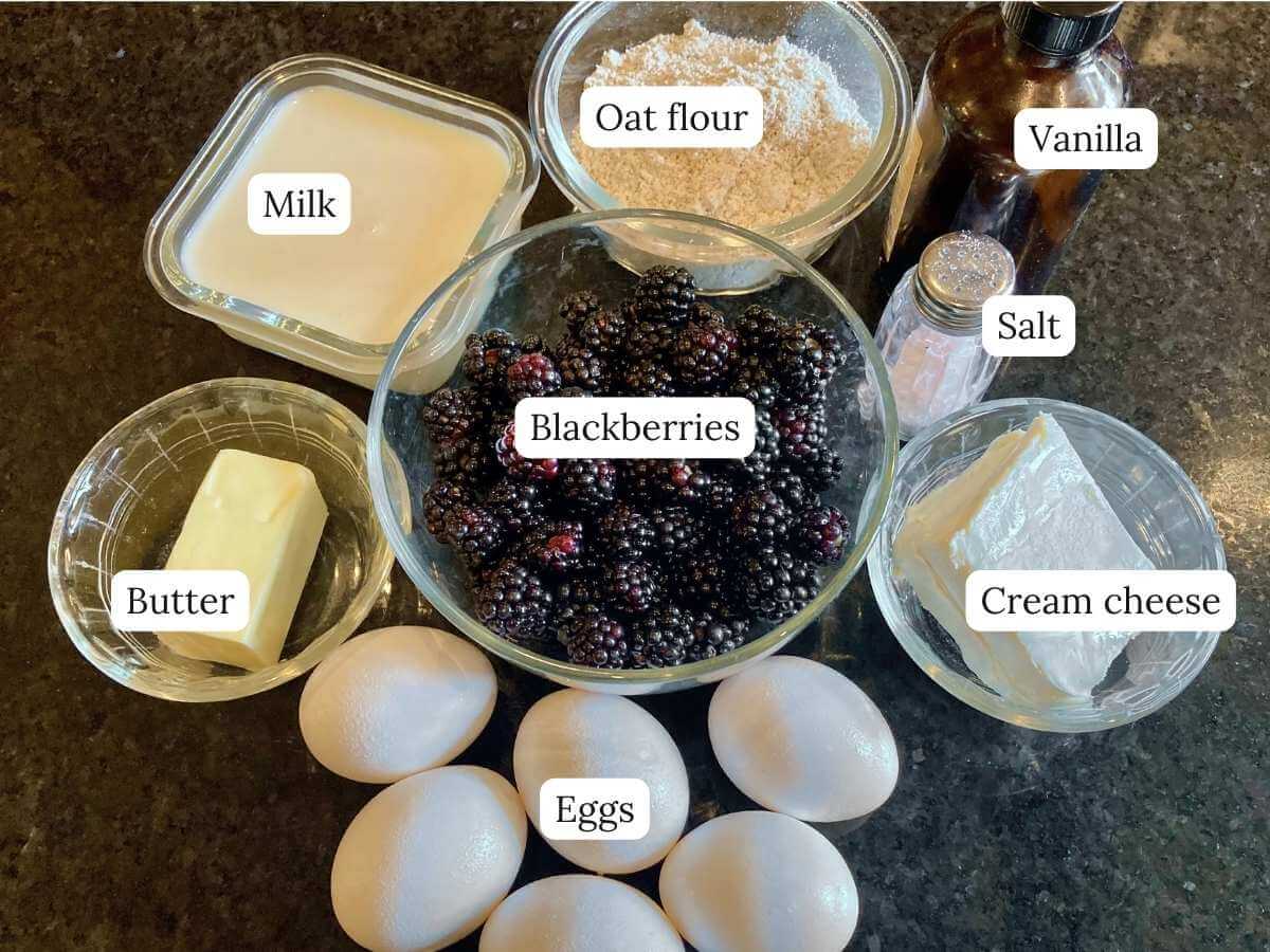 Ingredients for blackberry cheesecake German pancakes on a counter.