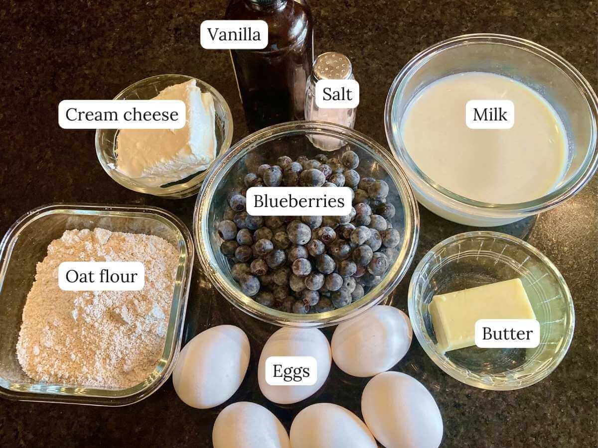 Ingredients for blueberry cheesecake German pancake on a counter.