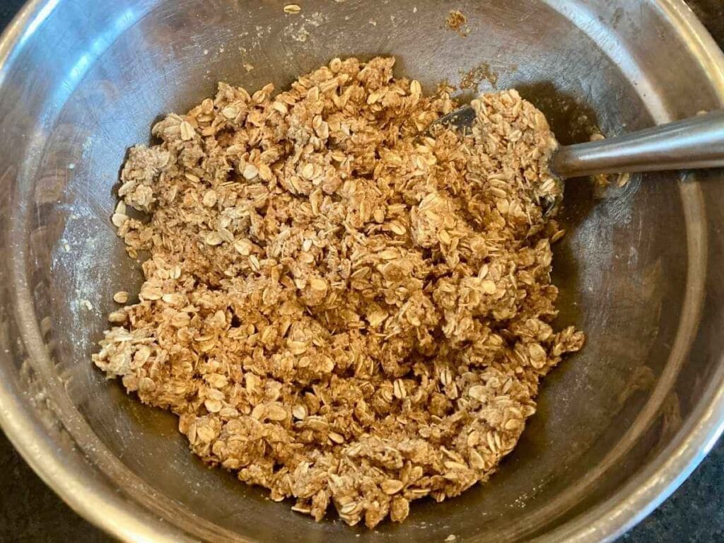 Mixing topping in a bowl.