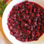 Closeup view of fresh cranberry sauce in a bowl ready to serve.
