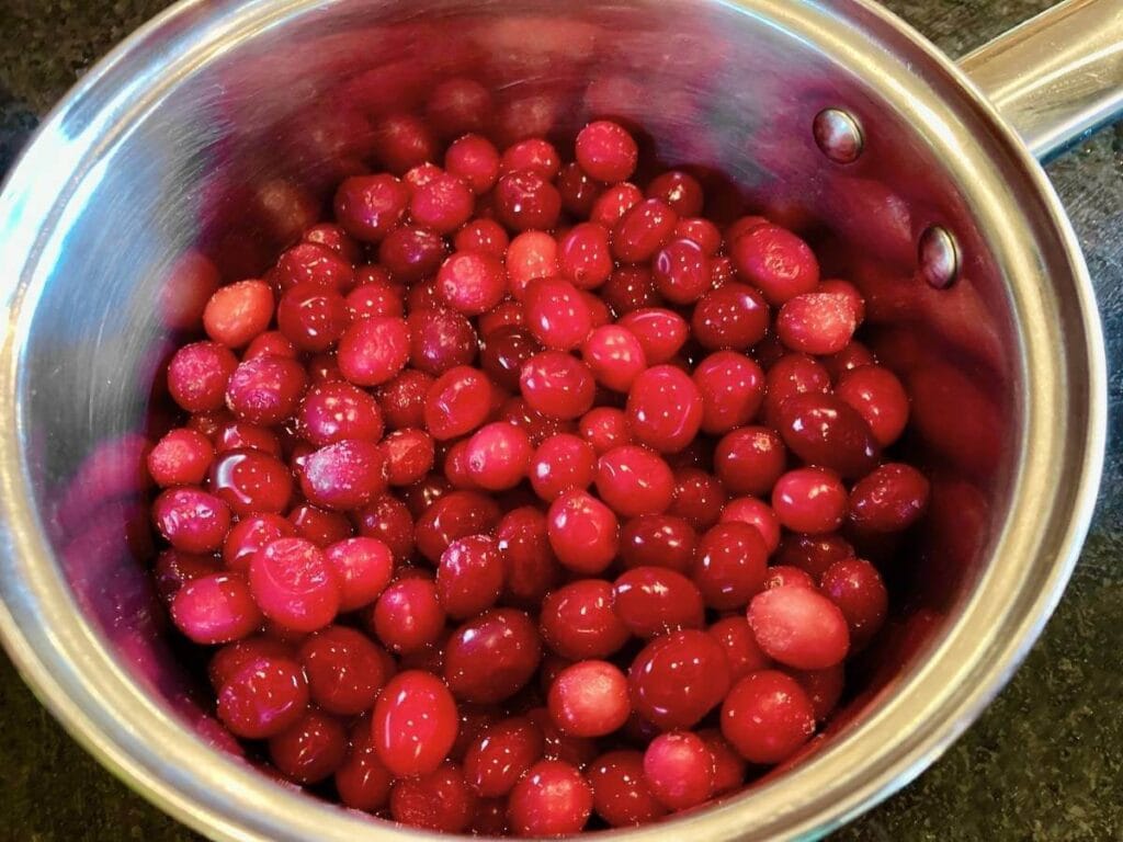 Cranberries in a saucepan.