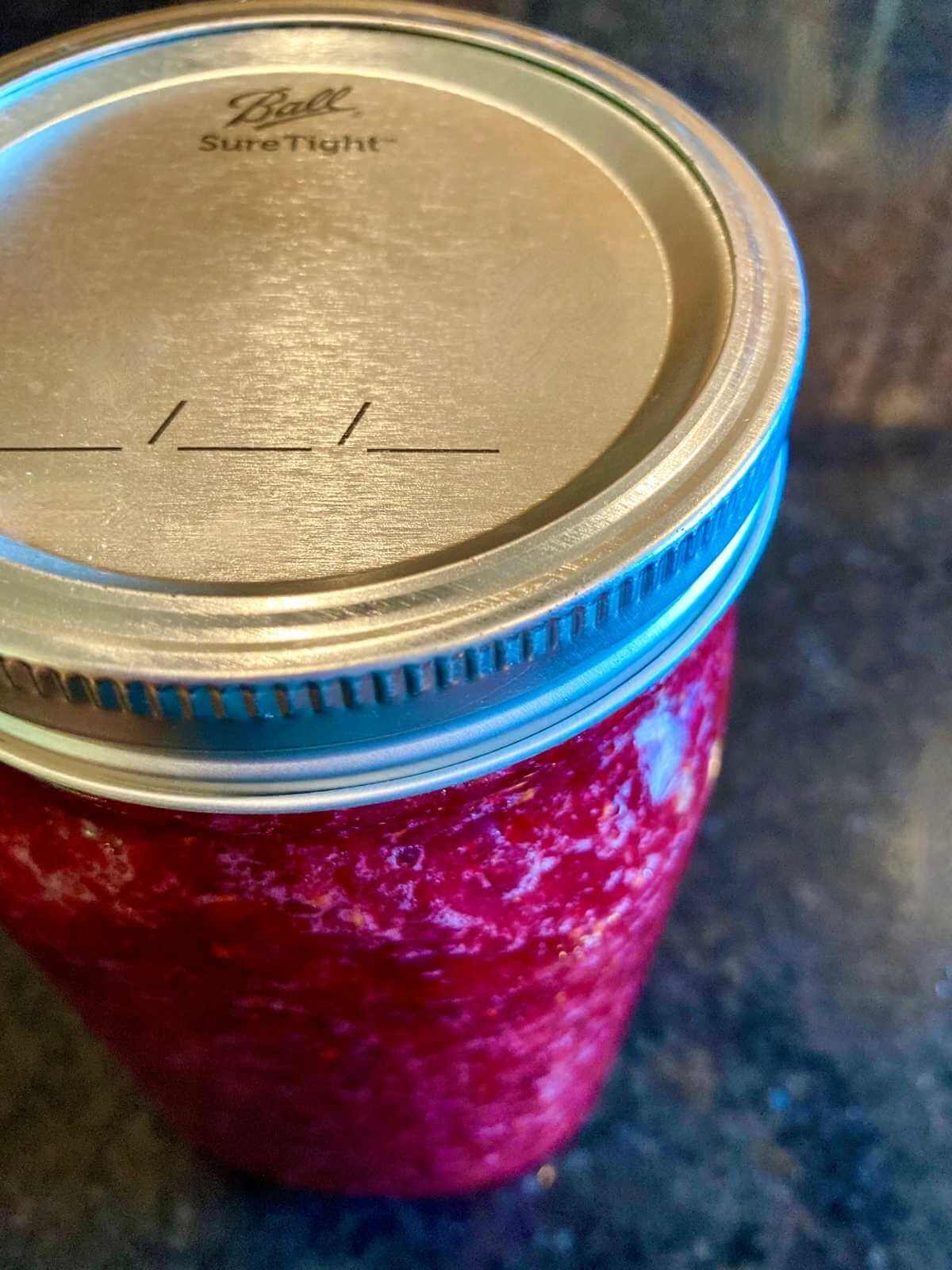 Jar with fermented cranberries.