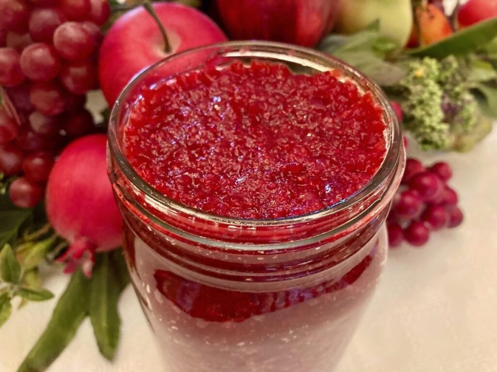 Fermented cranberries in a quart mason jar.
