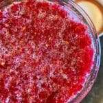 Open jar with fermented cranberries.