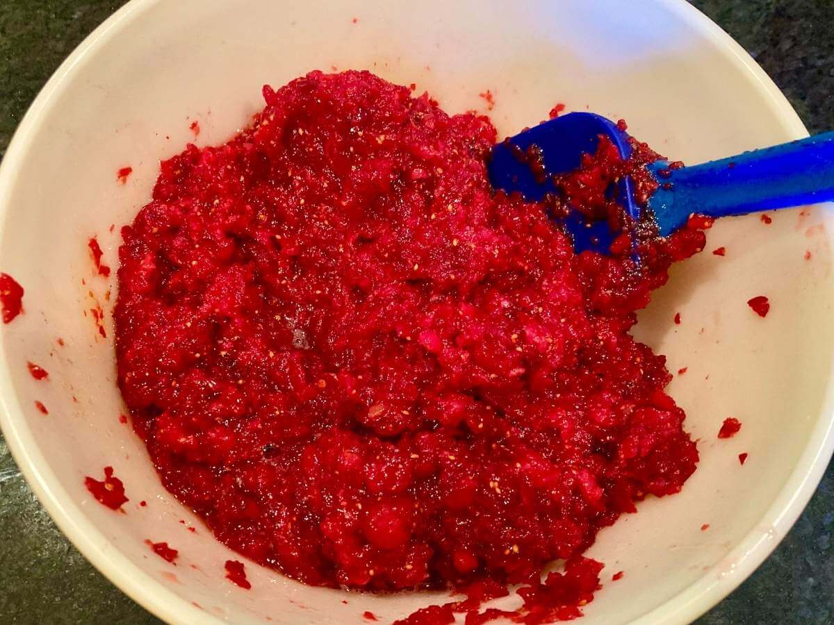 Honey and cranberry mixture in a bowl.