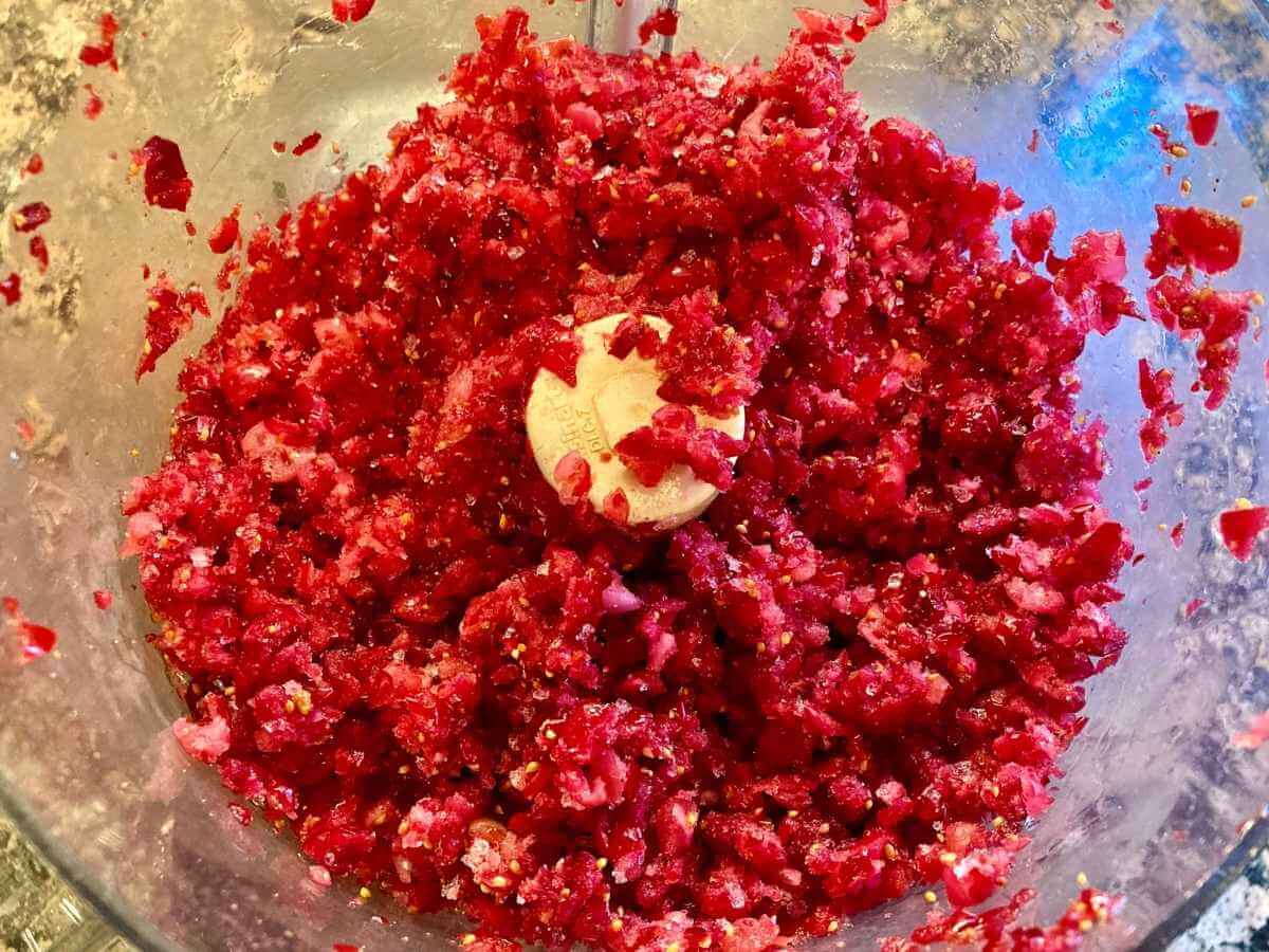 Chopped cranberries in a food processor.