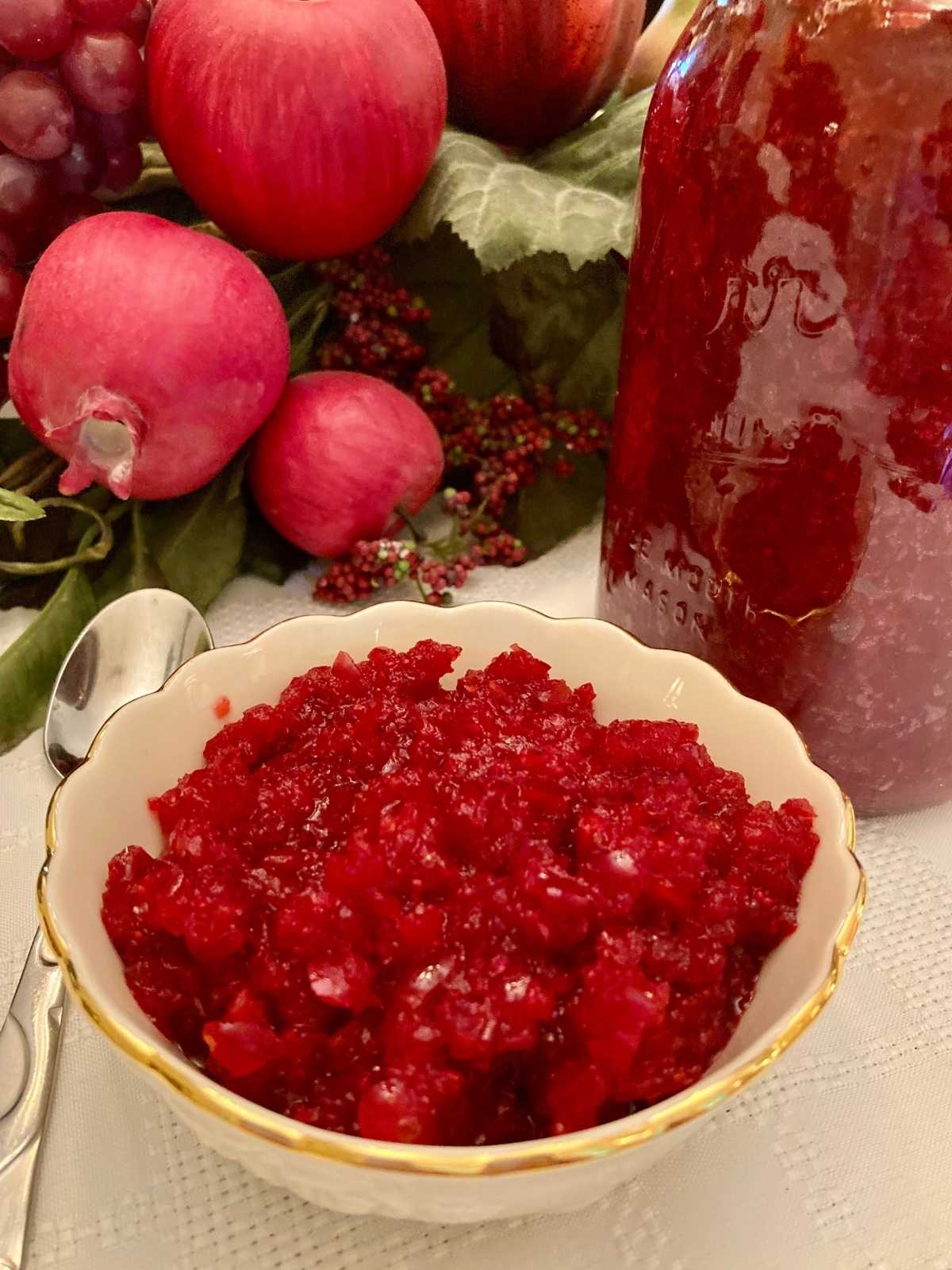 Fermented cranberries in a bowl and a jar.
