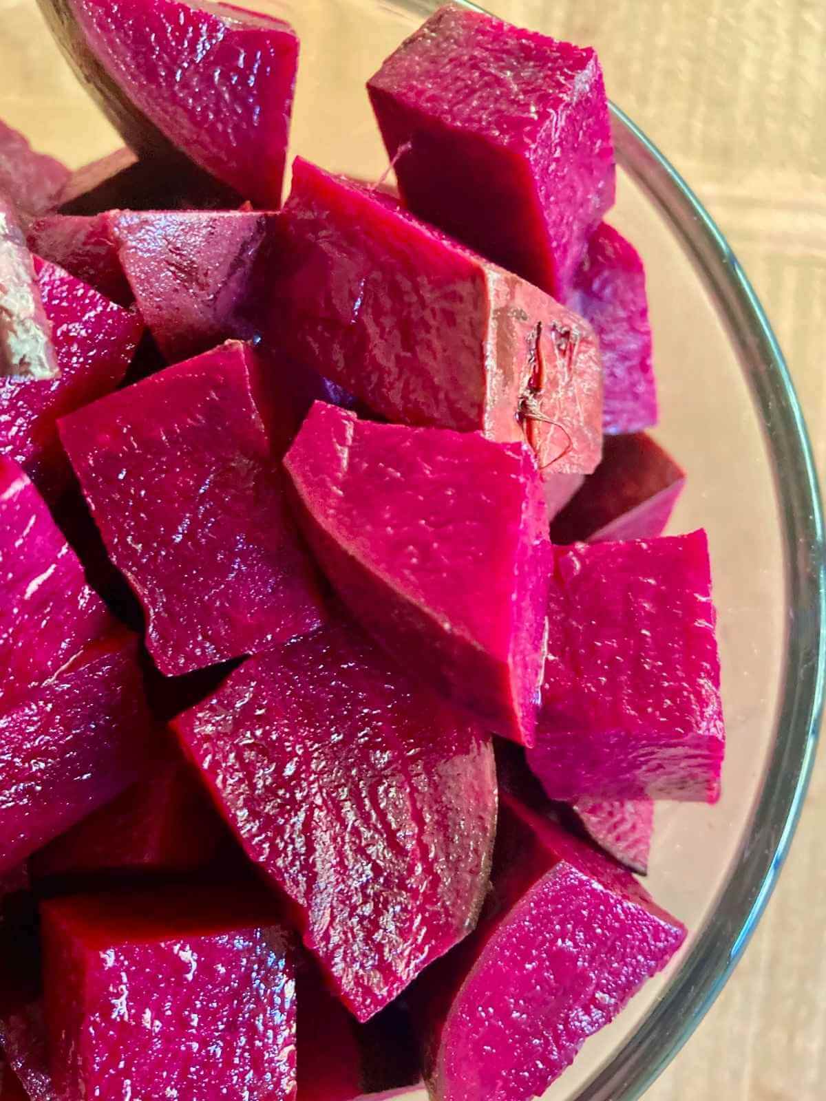 Beet cubes in a glass bowl.