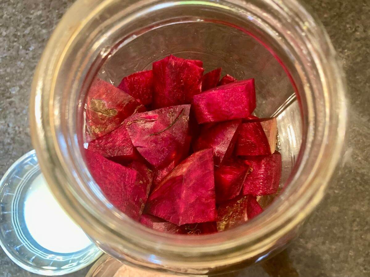 Beet cubes in a mason jar.