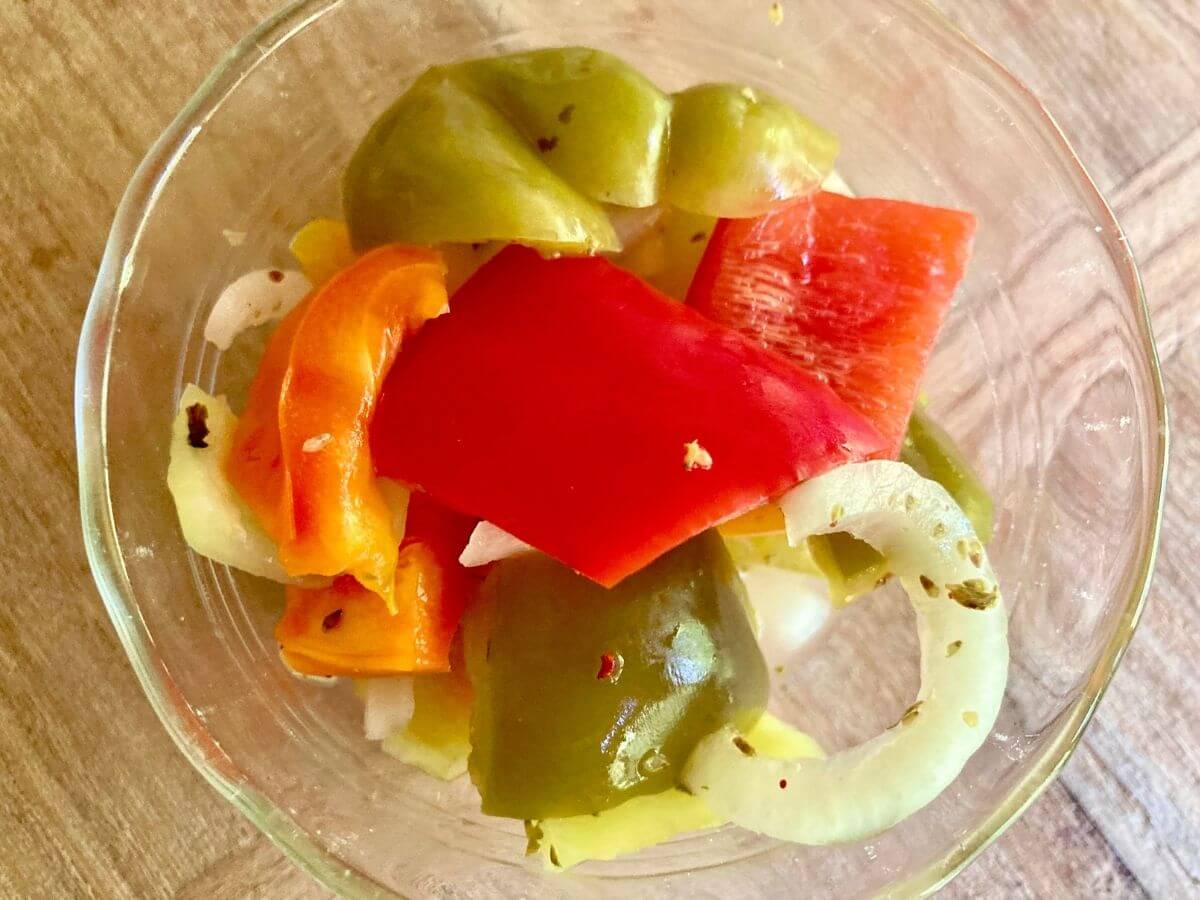 Closeup of fermented peppers and onions.