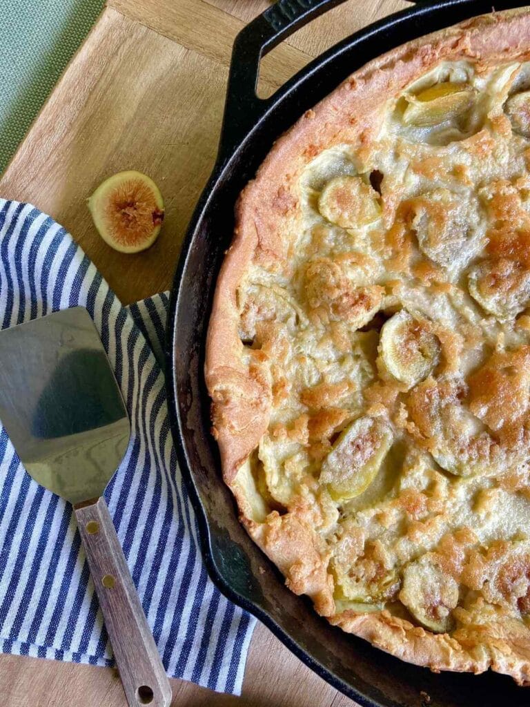 Fig Dutch baby in a cast iron skillet.