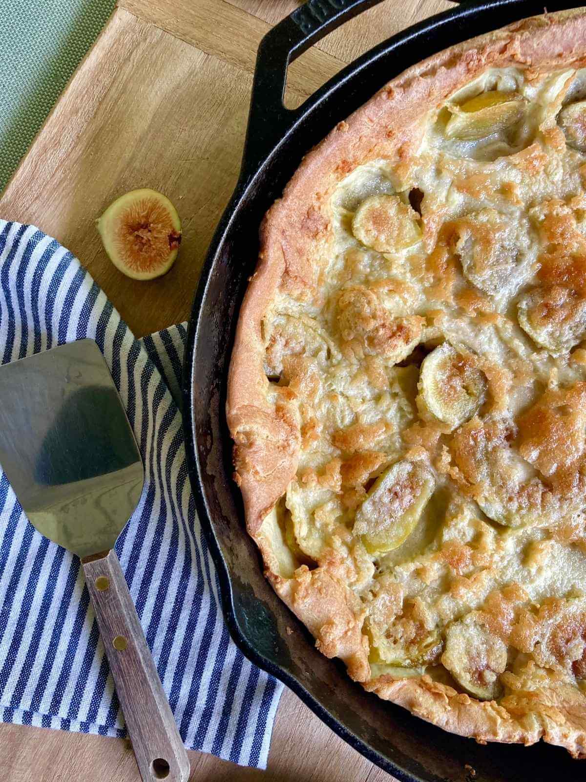 Fig Dutch baby in a cast iron skillet.