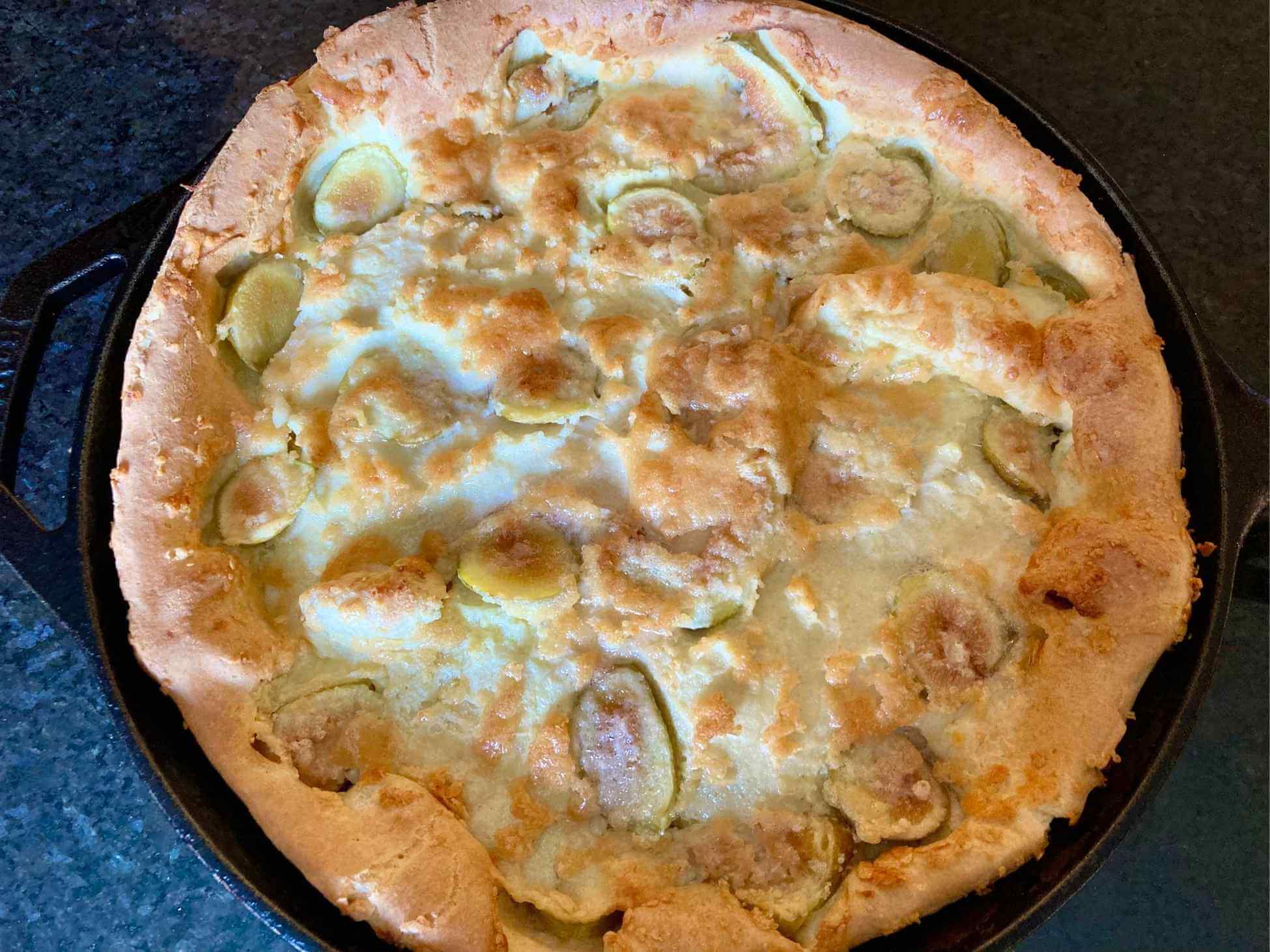 Fig Dutch baby in a cast iron skillet right out of the oven.