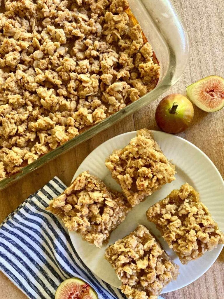 Gluten-free fig bars on a plate and in a baking dish.
