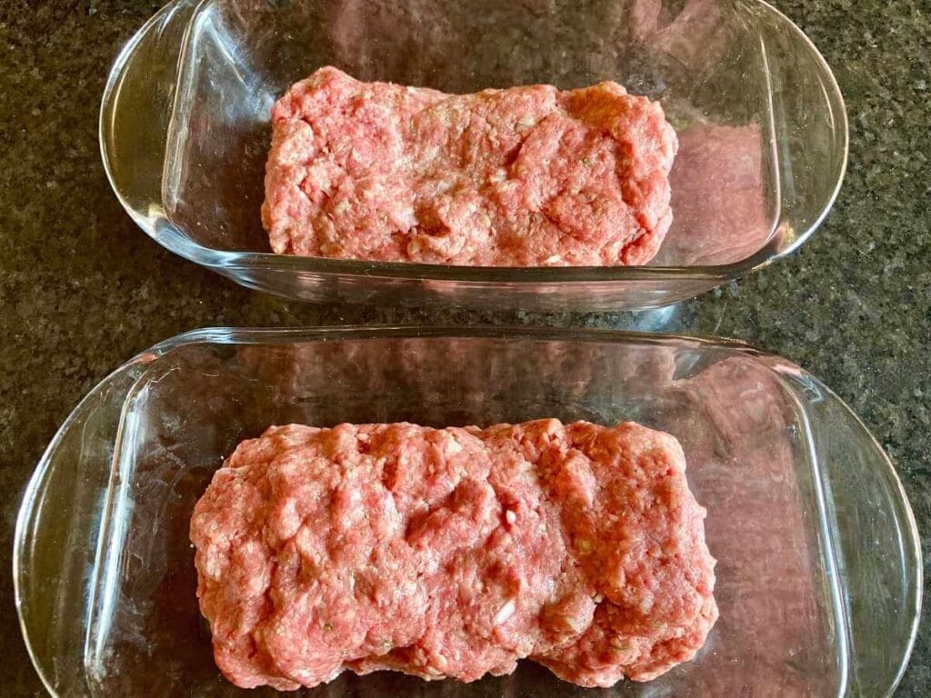 2 pans with unbaked meatloaf without sauce.