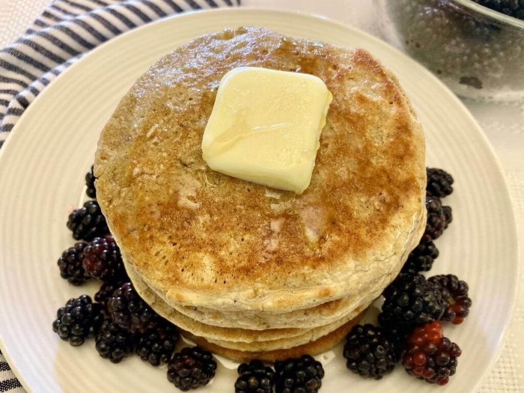 Stack of gluten-free oat flour pancakes on a plate.