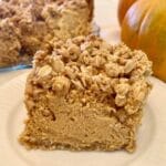 Gluten-free pumpkin cheesecake bar on a plate.