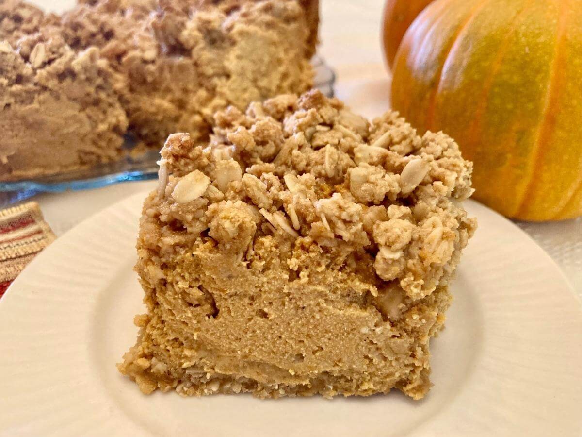 Gluten-free pumpkin cheesecake bar on a plate.