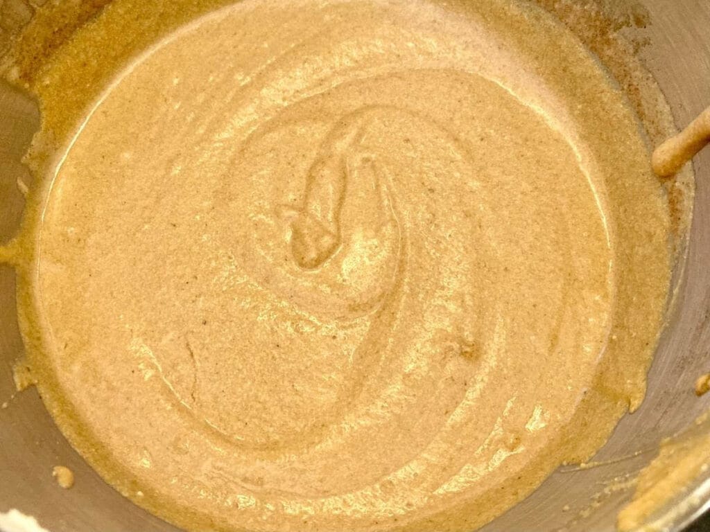 Pumpkin cheesecake batter in a bowl.