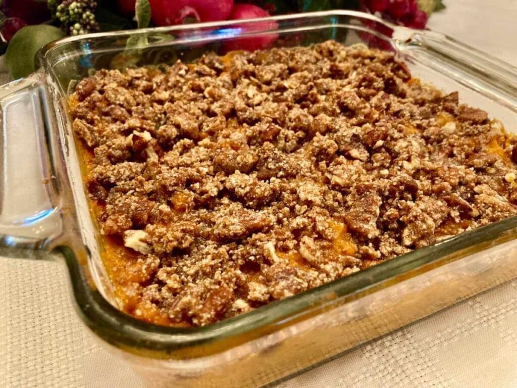 Side view of gluten-free sweet potato casserole in a baking dish.