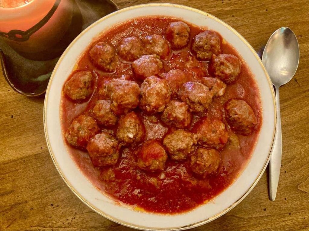 Gluten-free meatballs in a large serving bowl.