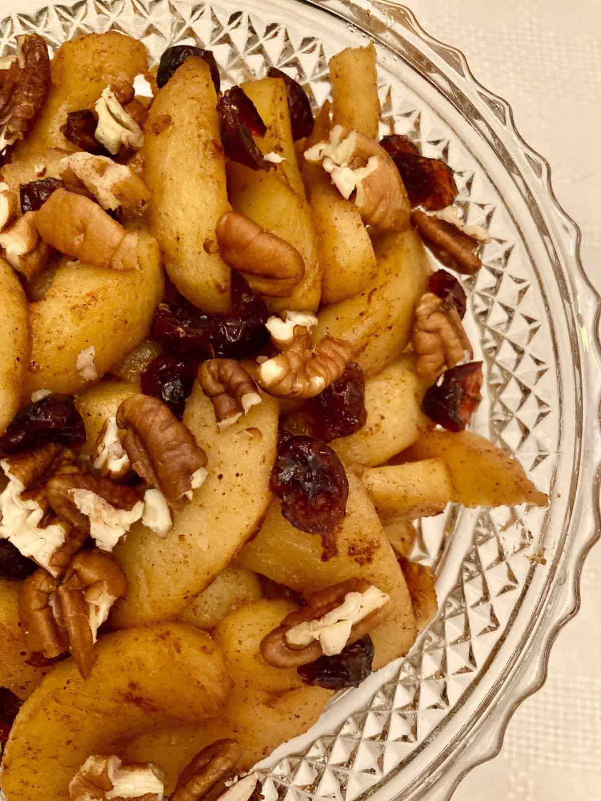 Closeup of healthy fried apples in a serving dish.