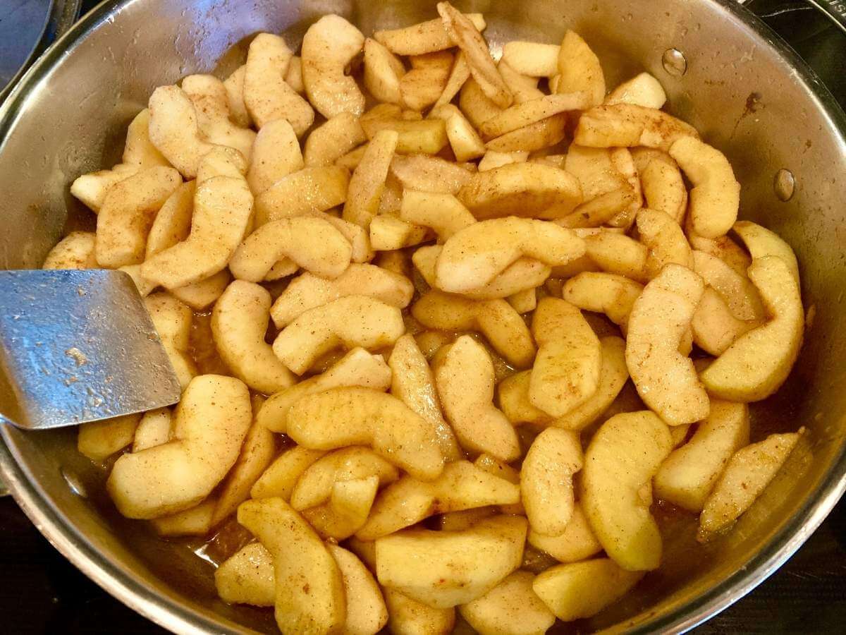 Frying apples in a skillet.