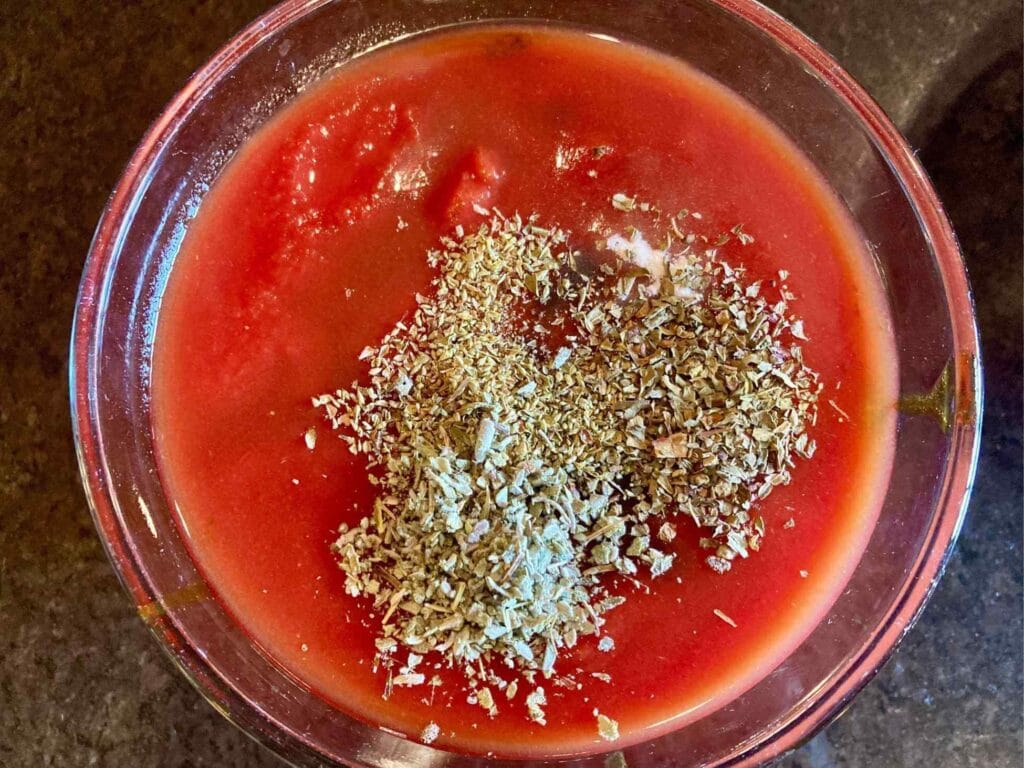 Tomato sauce with spices in a bowl.