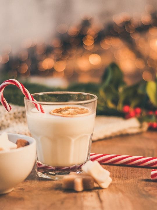 Glass of milk with candy cane