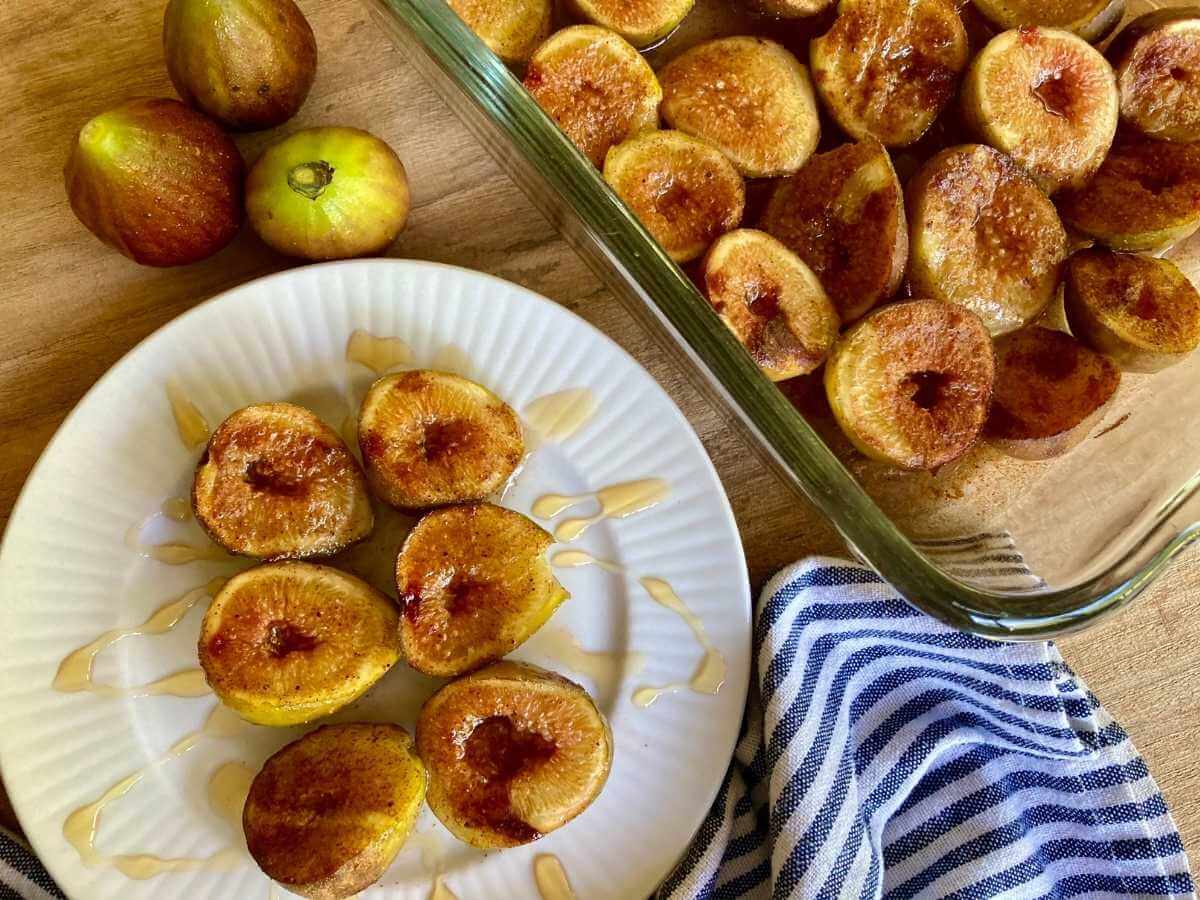 Roasted figs on a plate and in a baking dish.