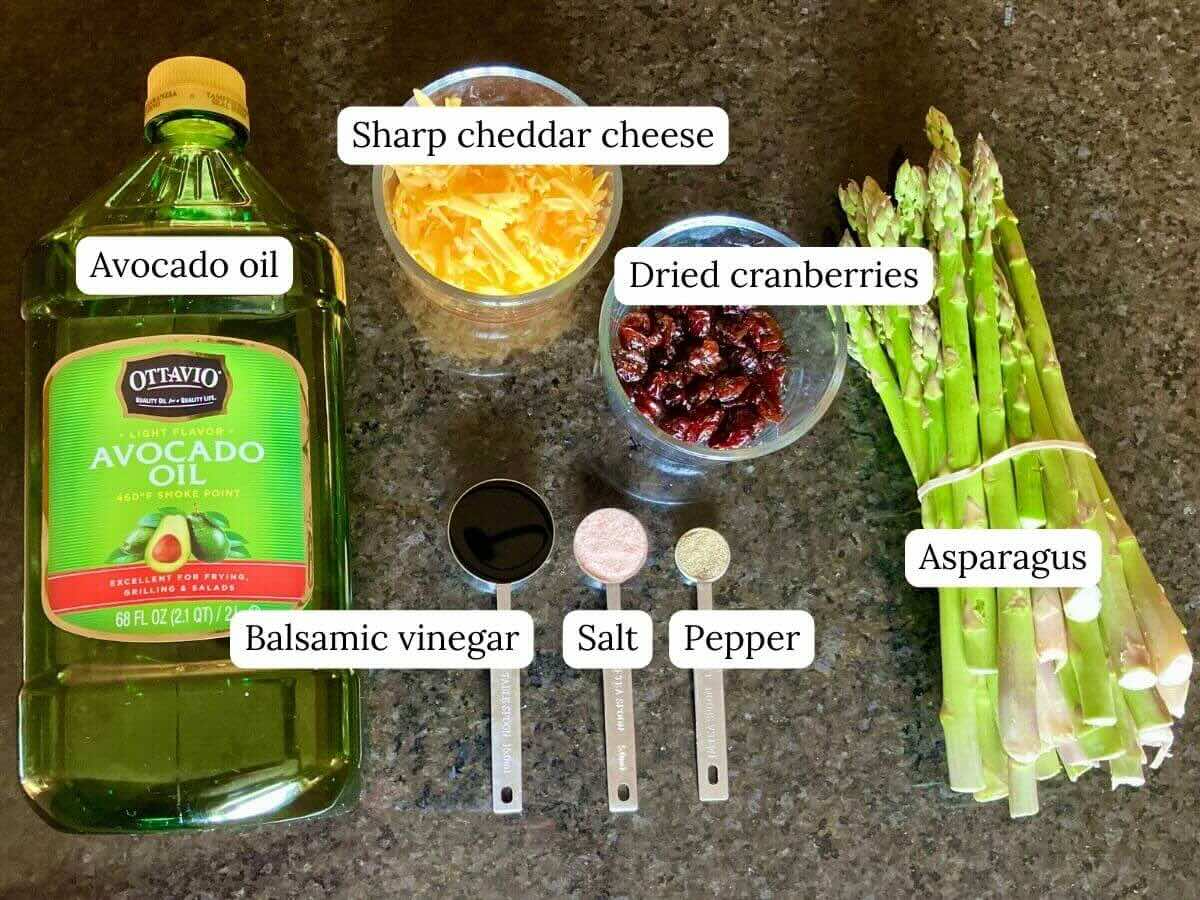 Ingredients for cheesy balsamic asparagus on counter