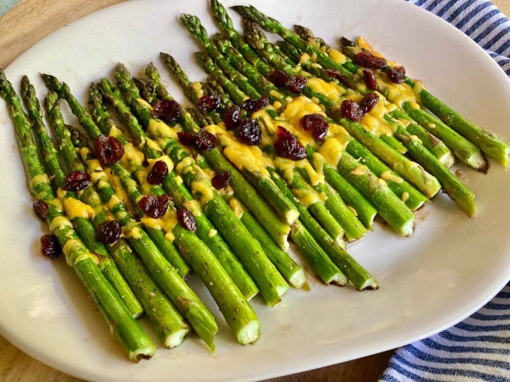 Cheesy balsamic asparagus on serving platter